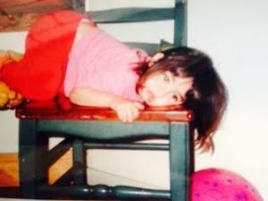 Lily climbing on chair